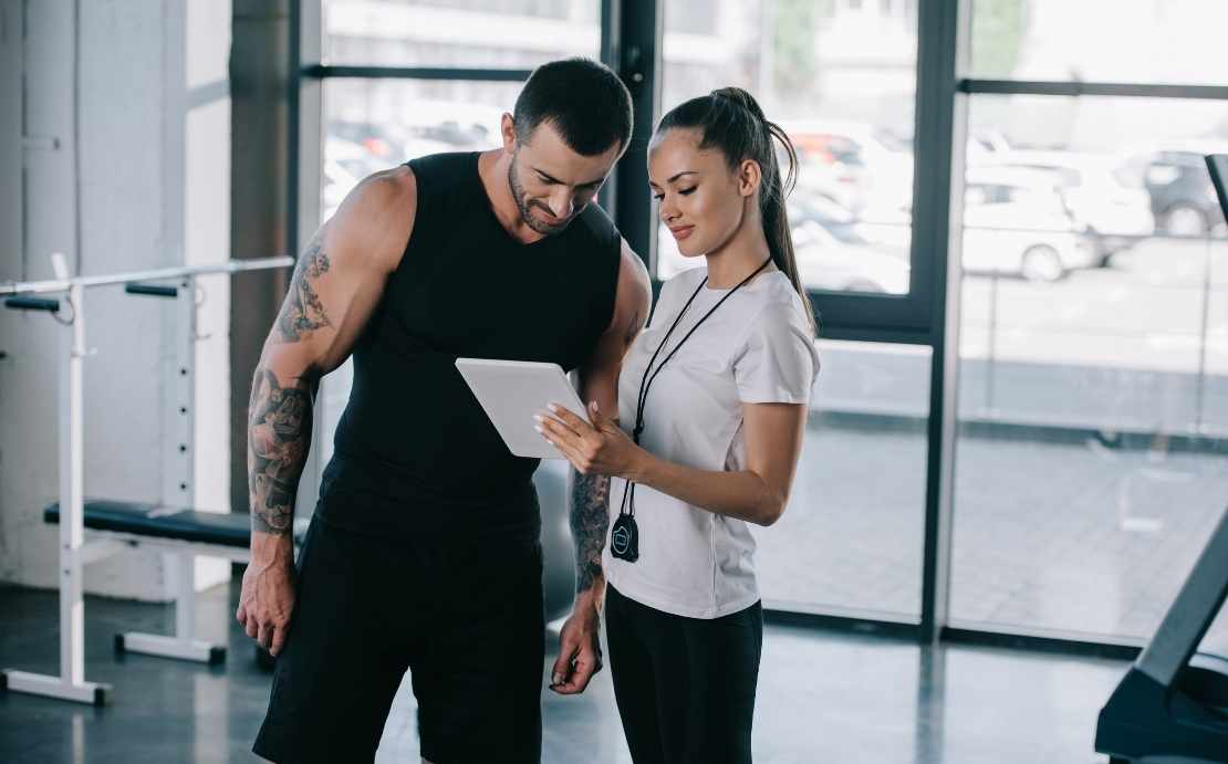 2 personal trainer looking over plan