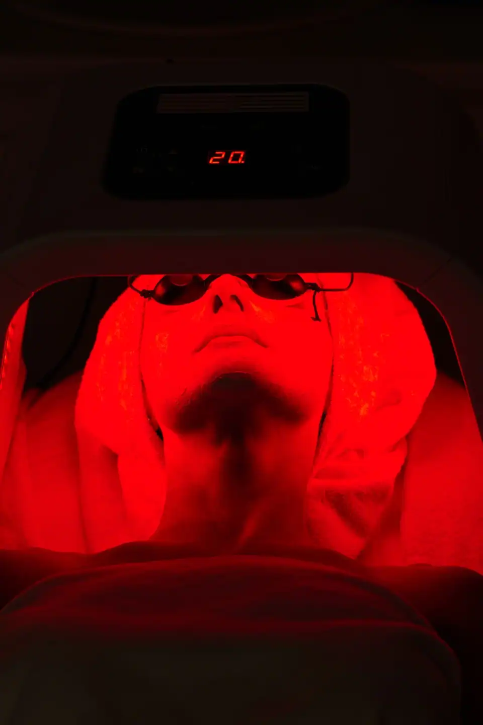 A woman receiving red light therapy at Alpine Fitness in Alpine, UT for muscle recovery, pain relief, inflammation reduction, improved circulation, post-workout recovery, and overall wellness using advanced LED and photobiomodulation therapy. Contact us today for help with Red Light Therapy in Lehi UT, red light therapy near me, red light therapy for muscle recovery Lehi UT, red light therapy for pain relief near me, red light therapy for inflammation Lehi UT, red light therapy for joint pain near me, red light therapy for post-workout recovery, red light therapy for athletes Lehi UT, LED light therapy near me, infrared red light therapy, photobiomodulation therapy Lehi UT, red light therapy sessions near me, red light therapy for circulation, red light therapy for injury recovery Lehi UT, red light therapy for wellness near me, non-invasive red light therapy, gym red light therapy Lehi UT, recovery center red light therapy, muscle recovery therapy near me, red light therapy for skin health Lehi UT, red light therapy for collagen production near me, red light therapy spa Lehi UT, red light therapy treatment near me, advanced recovery therapy Lehi UT, performance recovery red light therapy, fitness recovery services near me.